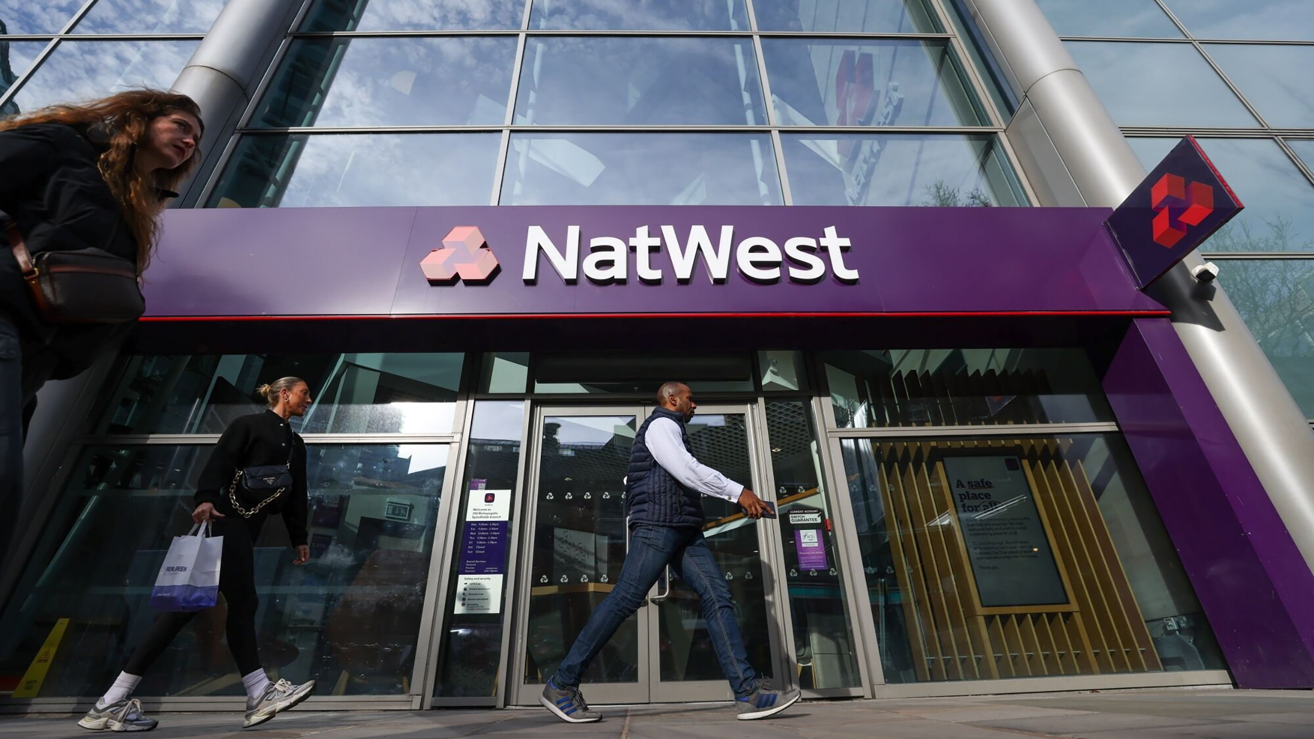 A modern bank branch interior with a customer service desk, symbolising secure financial transactions.